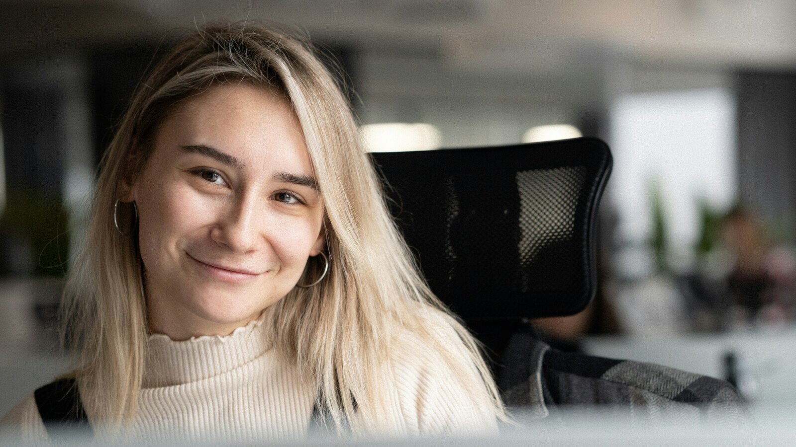 Friendly support professional at a desk