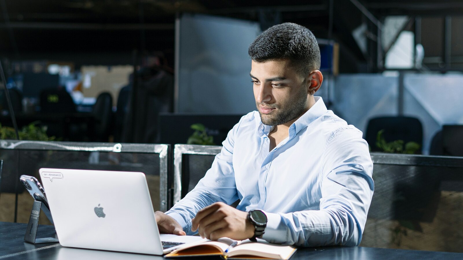 Aviation professional studying on a laptop